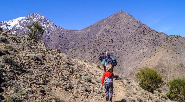 Hiker on a mule trail in the High Atlas above the Ourika Valley