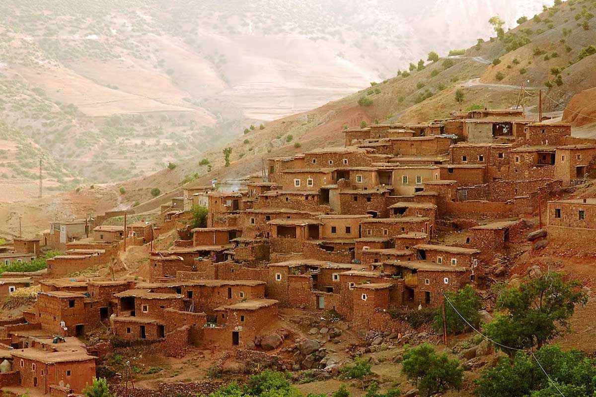 Earth houses of a Berber village stepping up a slope of the Ourika Valley